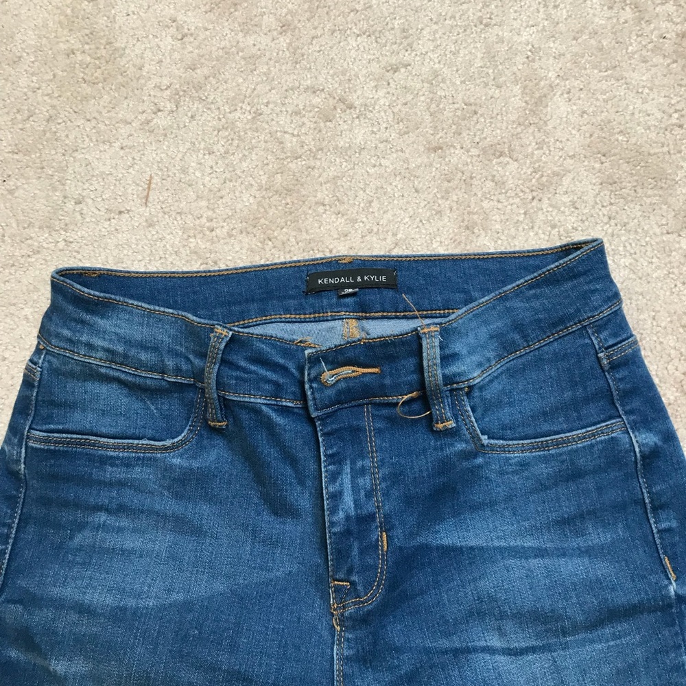 Kendall and Kylie partially ripped jeans.